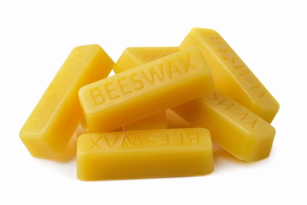 Beeswax blocks on a white background
