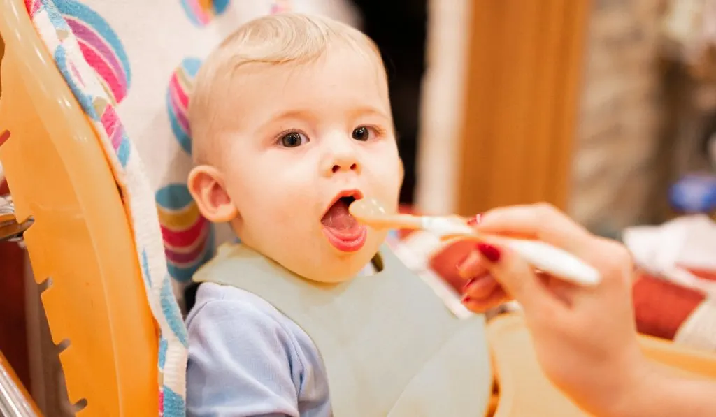 Little baby eating from spoon
