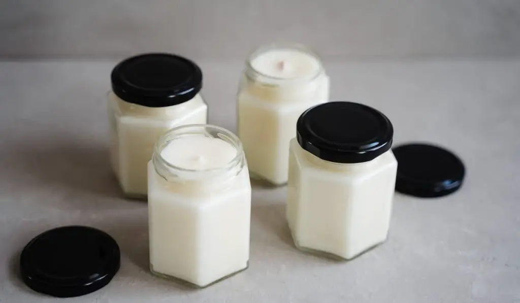 Natural soy candles in glass jars with lids.
