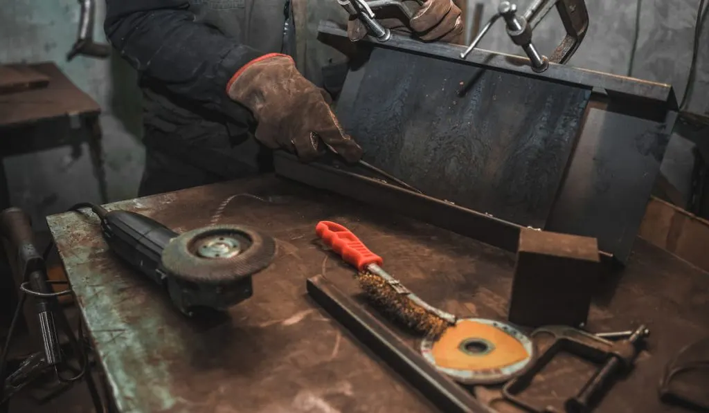 man working wearing hand gloves